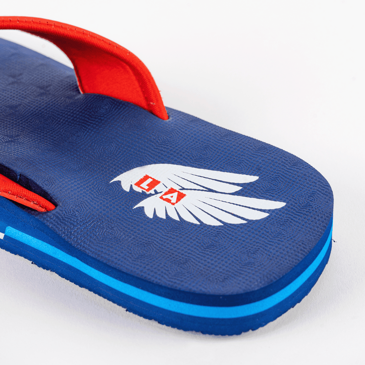 Stylish and patriotic The Gringos flip flops in Red, White, and Blue, perfect for showcasing your FLY spirit