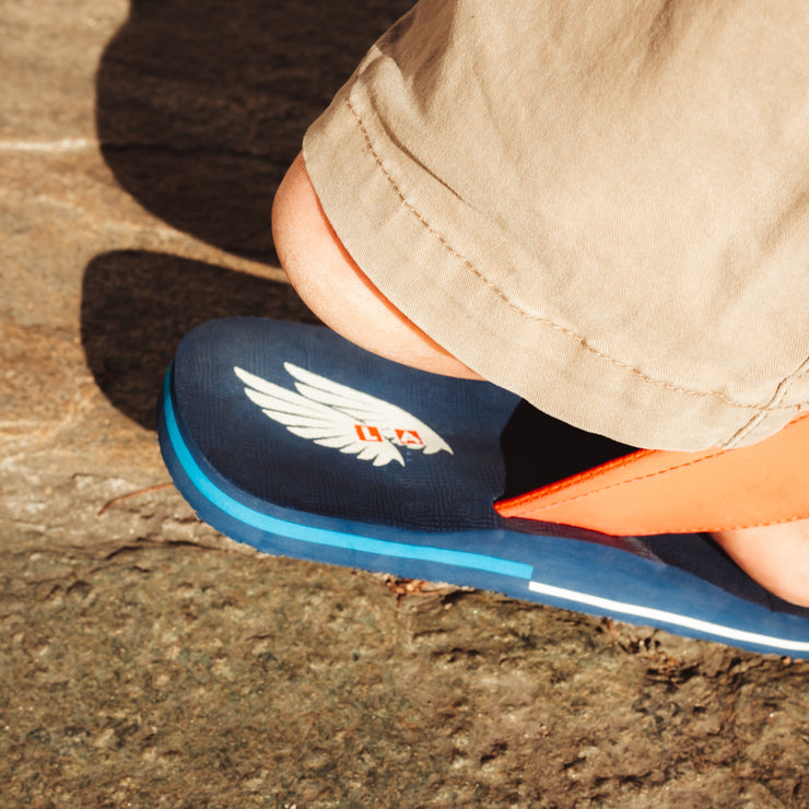 Stylish and patriotic The Gringos flip flops in Red, White, and Blue, perfect for showcasing your FLY spirit